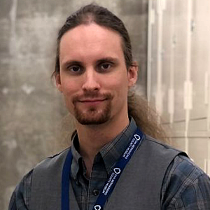 A photo of the curator of earth sciences for the san Bernardino County Museum.