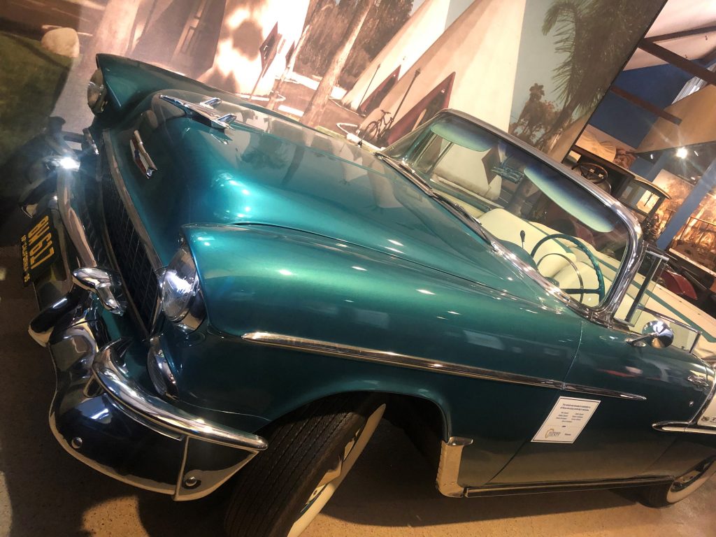 A photo of a 1950 green Cadillac convertible is seen on display at the museum.