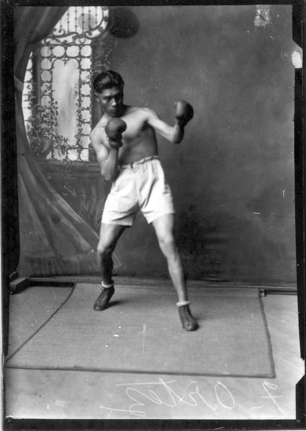 Glass plate negative of Frank Ortez