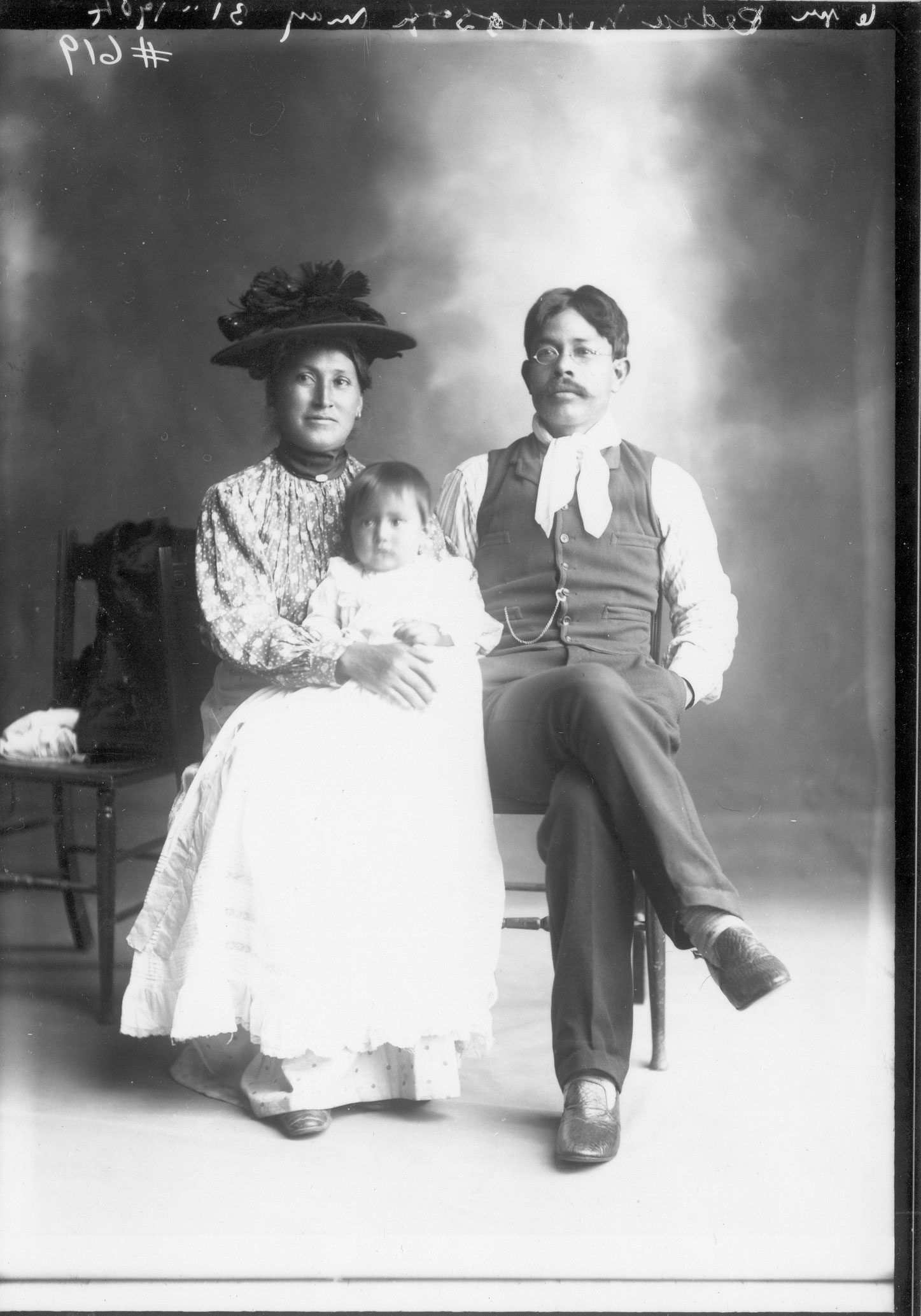 Glass plate negative photograph of Pedro Munos and family