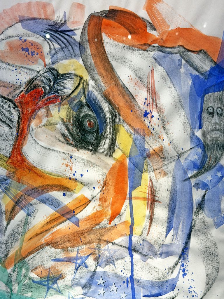 Abstract mixed media artwork featuring dynamic brushstrokes in red, orange, blue, and black, layered over a swirling, chaotic composition. The image hints at the form of a distorted face or eye at the center, surrounded by expressive marks and splatters. Elements like stars and stripes subtly reference the American flag, blending into the motion and color. A ghostly figure with wide eyes emerges faintly on the right side, adding a surreal or unsettling tone to the energetic piece.